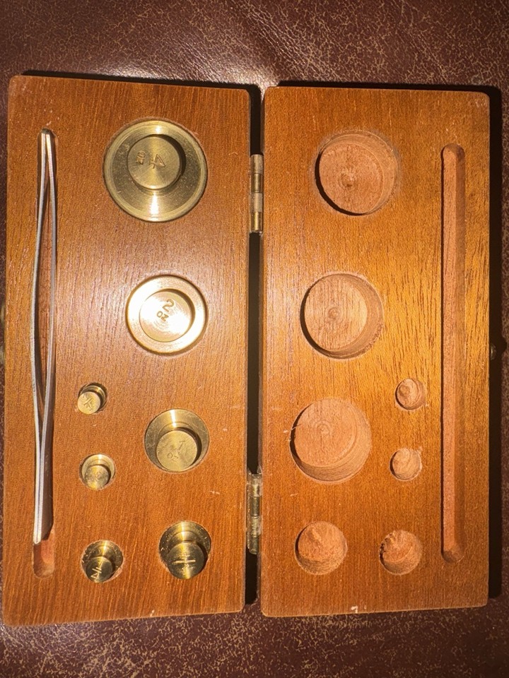 A genuine brass laboratory weight set from Henry Troemner — the kind of precise, beautiful scientific artifact that doubles as serious shelf décor.