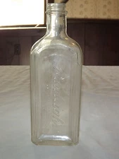   VINTAGE 8 1/2" HIGH RAWLEIGH'S EMBOSSED MEDICINE BOTTLE