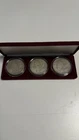 1921 PDS Set of 3 Morgan Silver Dollars in burgundy color velvet case