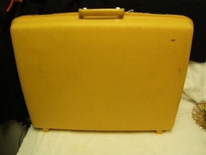yellow hard suitcase