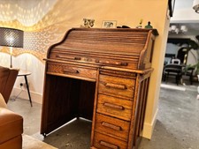antique oak roll top desk ,good condition, cubby holes' inside plus 2 drawers.