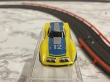 ho slot car Afx Blue And Yellow Number 12 Corvette Light Works Perfect Nice Car