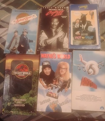 Lot Of 7 VHS Tapes 80's-90's Strange Brew Lost World, Wayne's World, Hot To Trot