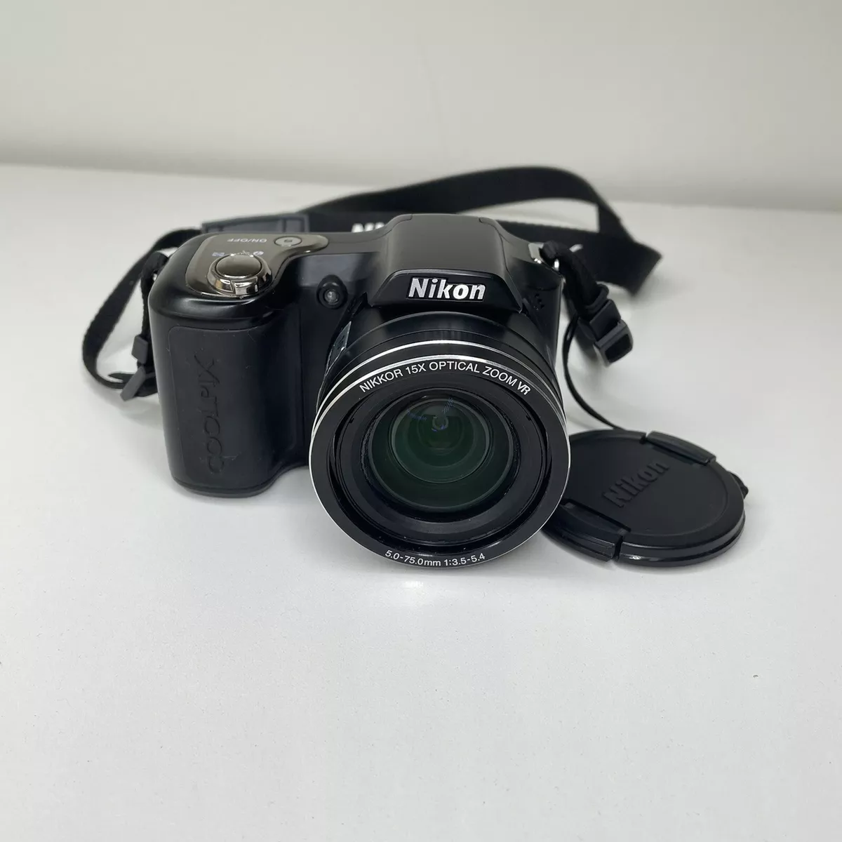 Nikon Coolpix L100 10.0 MP Digital Camera Wide 15X Optical Zoom Black Strap Lens