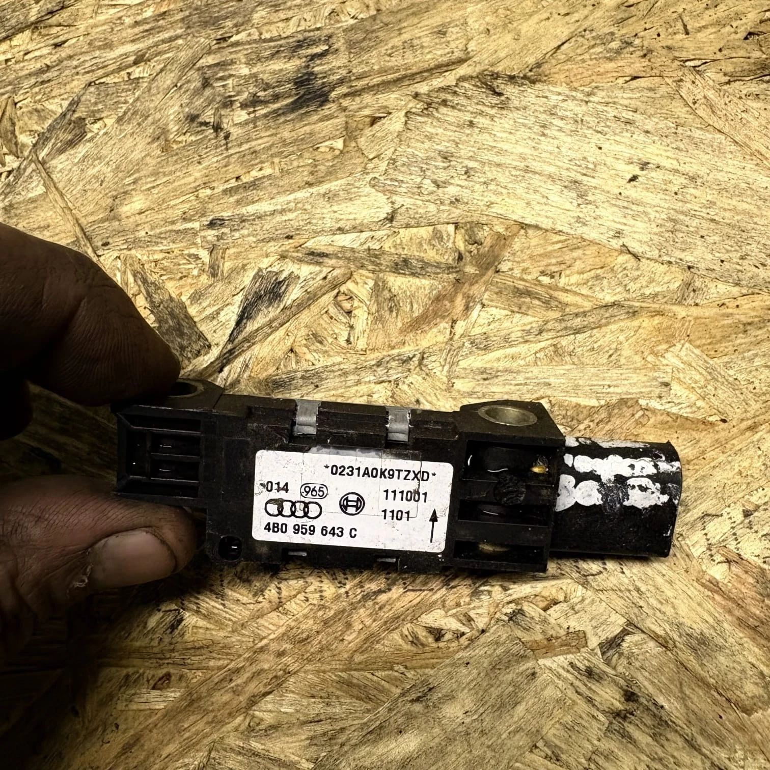 Audi lateral impact sensor metal mounting detail