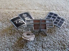 VINTAGE ORIGINAL CORVAIR EMBLEM CROSS FLAGS # 37953 TRUNK CHEVY GM
