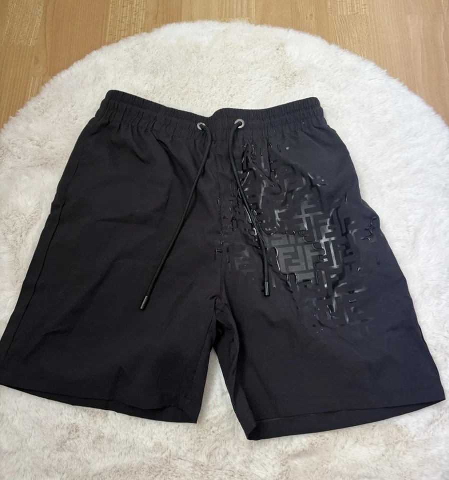 Short de bain noir réactif à l’eau - Photo 1/1