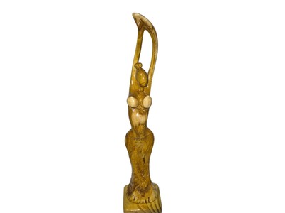 Wood sculpture:Harmony in Motion'', highlighting the elegance of the carved f