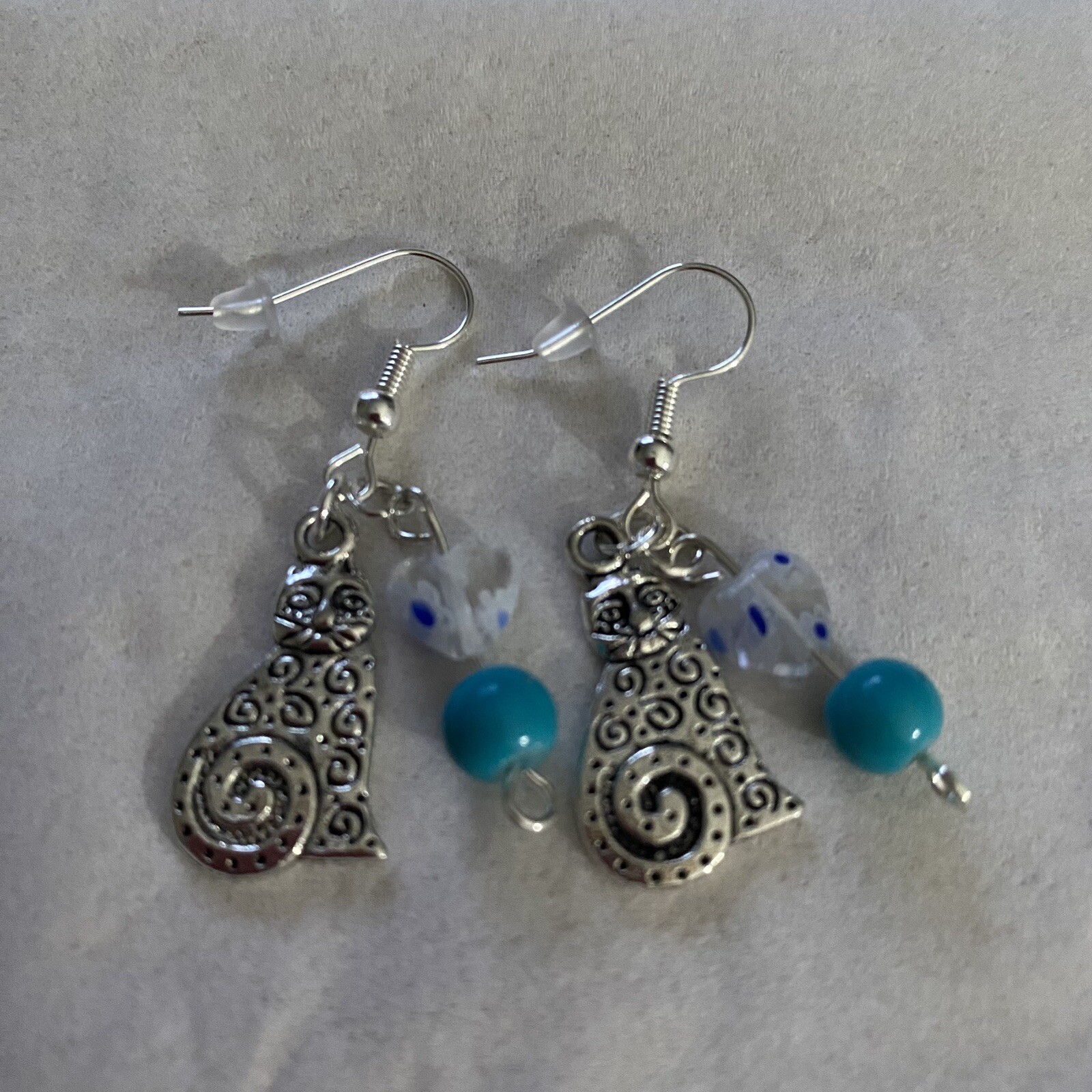 Handcrafted Silver Cat Dangle Earrings with Blue Beads and Silver Hooks-image