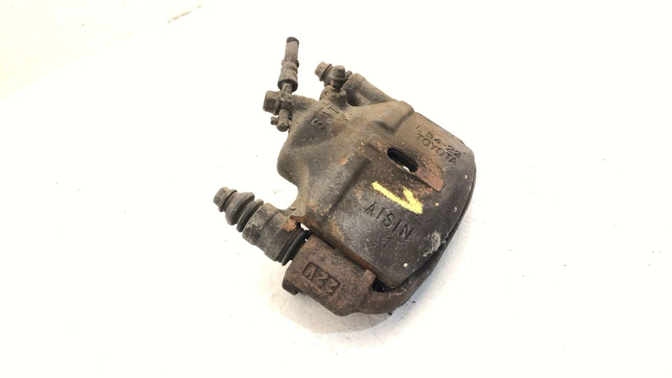 Pinza de freno delantera izquierda Toyota Camry Driver 1986 con soporte de montaje 4775032041 Foto 2 de 4