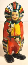 VINTAGE TIN LITHO NATIVE AMERICAN CHIEF HOLDING KNIFE & TOMAHAWK WIND-UP  U.S.A.