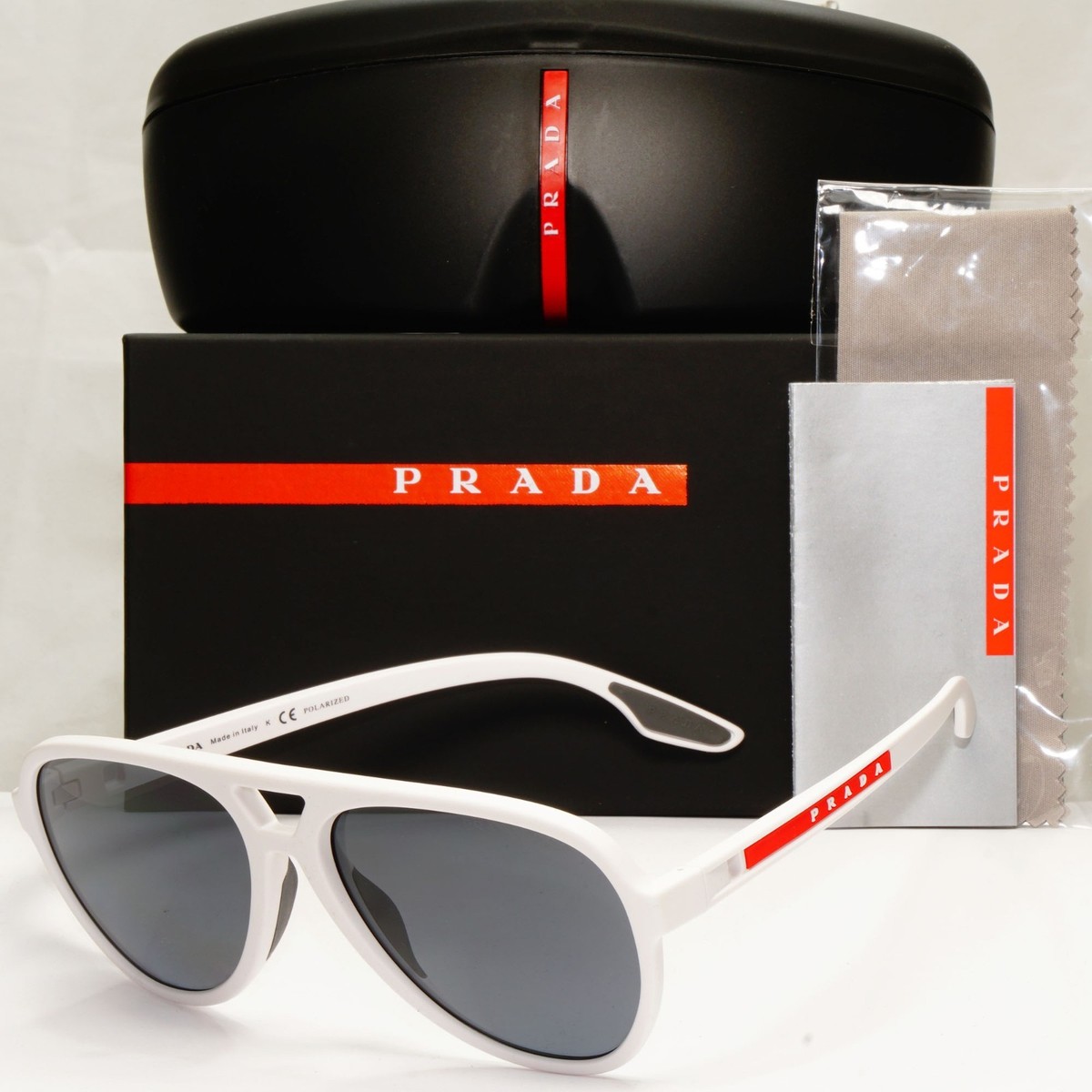 PRADA MADE IN ITALYホワイトサングラス　ケース付　箱クリーナー Prada White Polarized Sunglasses Pilot Grey Red Stripe PS06WS SPS