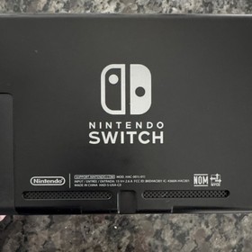 Nintendo Switch Console with Dock, Controller Grip, Power Adapter, and Cables