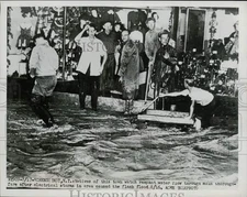 1951 Press Photo Schenectady natives watch flash flood waters flow through town