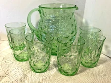 GREEN OVAL COIN PATTERN DEPRESSION GLASS PITCHER AND 6  MATCHING TUMBLERS 1930'S