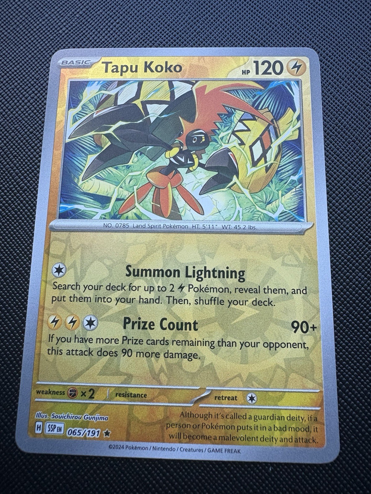 Tapu Koko SV08: Surging Sparks Pokémon #065/191 Reverse Holo NM