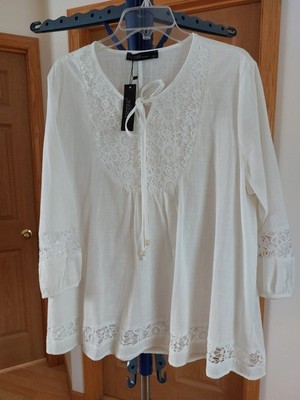 A white cotton blouse with a relaxed, flowy silhouette, three quarter sleeve  XL