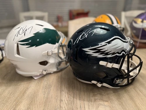 (2) Michael Vick Signed Philadelphia Eagles Helmets. 1 replica. 1 authentic.