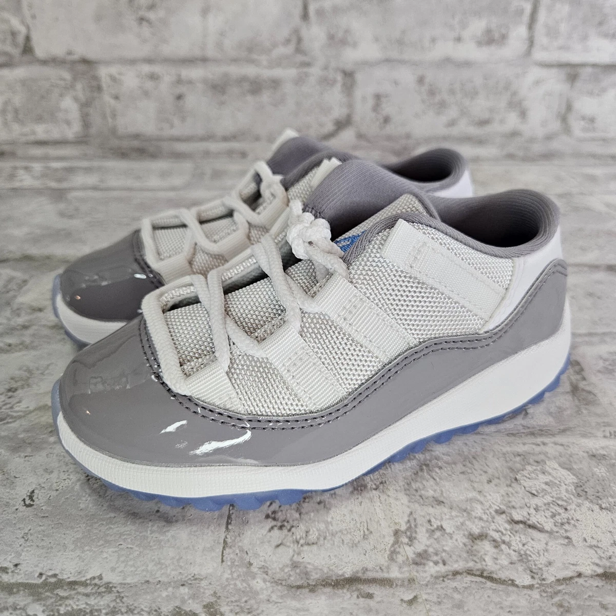 Jordan Brand Air Jordan 11 Retro Low 'Cement Grey' WHITE/UNIVERSITY BLUE- CEMENT