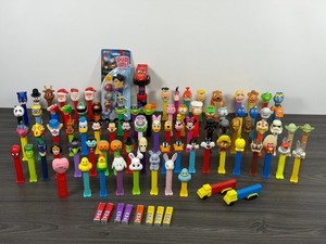 Assorted Lot of 84 Pez Dispensers, 3 without feet – will NOT split Lot