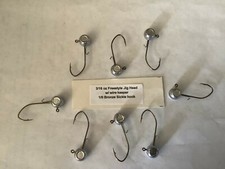 25 Hand made 3/16oz w/ keeper freestyle jig heads with a 1/0 bronze sickle 