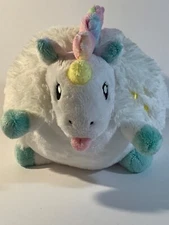 9” Squishable. White furry body dragon accented with plaster colors. Round. 