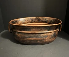 large, antique-style copper pot or cauldron