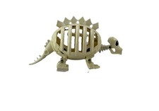 STÉGOSAURE MONTRE EGG MONSTERS BANDI DINOSAUR SKELETON 1987 JEUX PRÉCIEUX