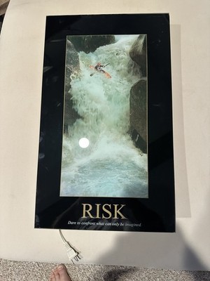 Risk Motivational Picture with Light & Sound. Kayaker moving through River Falls
