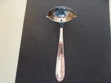 Cuillère à sauce, maigre et gras, en métal inox.