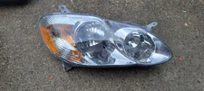 2003-04 Toyota Corolla Passenger Side Headlight Assembly Eagle Eyes TY665-B001R