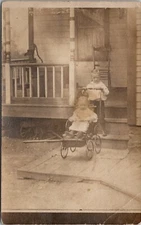 RPPC Little Boy with Baby in Stroller Wagon Well Pump on Porch c1910 Postcard X8