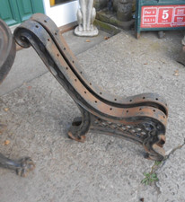 A PAIR OF ANTIQUE CAST IRON GARDEN BENCH ENDS