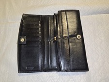 vintage Coach black pebbled leather wallet  a kisslock design.