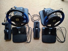 Pair of Steering Wheels, foot pedals, handbrake gear lever for PS2 racing games
