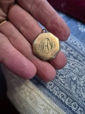 antique locket with photos old old piece found in military jacket