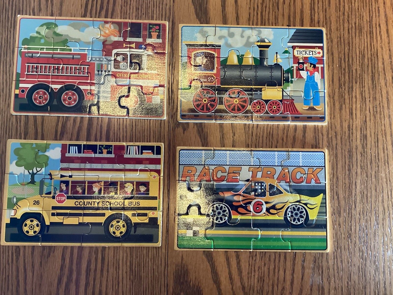 4 Wooden Puzzles in a Box by Melissa and Doug - 4 boxes = 16 puzzles.  Pre owned