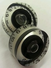 2 Guitar speed volume/tone knobs from 0-11. Pearl White/Black..  JAT