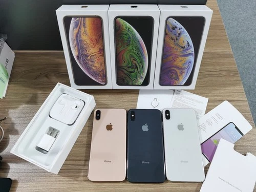 Sealed Apple iPhone XS MAX in three white boxes with yellow, black, and silver devices, each showing 64GB/256GB storage.