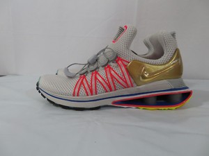 nike shox gravity vast grey metallic gold