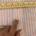 Light pink LL Bean short sleeve oxford with blue and white vertical stripes, button-down collar, and small white tag on chest.