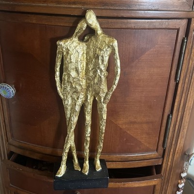 Statue of Two Golden People Sculpture