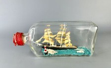 Vintage Folk Art Ship In A Bottle Diorama of a Sailing Ship before a Lighthouse