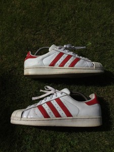 white adidas with red stripes