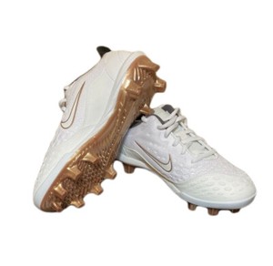 gold and white softball cleats