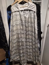 A Silverr And White Hooded Cloak With White Linning