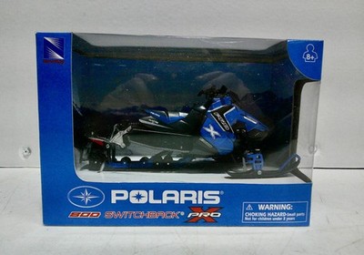 Toy New Ray Polaris 800 Switchback Pro snowmobile. 1/16 scale with the box.