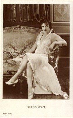 Postcard Actress Evelyn Brent Posing On The Sofa In Dress,... - 11659854