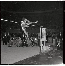 John Thomas who will be 18 March clears bar high jump event of Mil- Old Photo