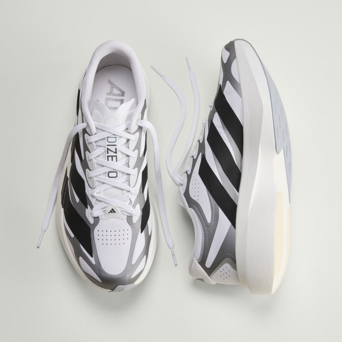 Adidas ADIZERO EVO SL EXO Shoes in Cloud White/Core Black/Iron